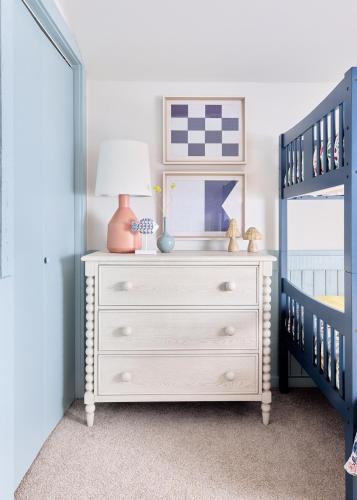 a bedroom with a white dresser with a lamp on it at Unique LKN Waterfront Home with Dock in Mooresville