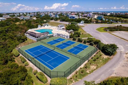 an overhead view of a tennis court with four tennis courts at 8455 - Mad Hatteras in Avon