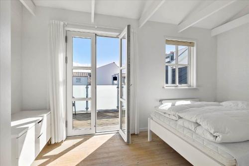 Ένα ή περισσότερα κρεβάτια σε δωμάτιο στο TV1281-Bindslev-Tannisbugtvej-49-D-Nr-6