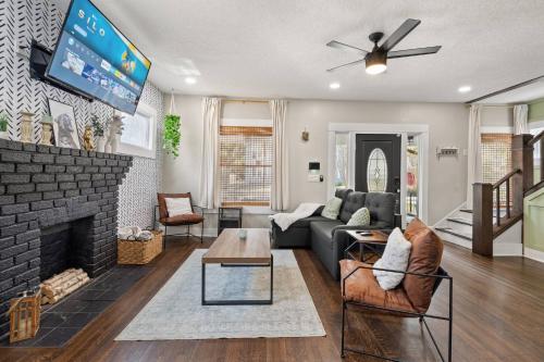 a living room with a couch and a fireplace at Historic 4BR Home centrally located in Riverside. in Jacksonville