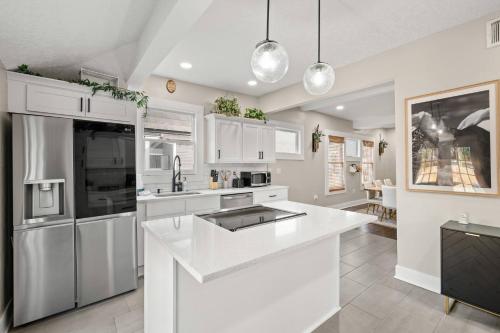 a kitchen with white cabinets and a white counter top at Historic 4BR Home centrally located in Riverside. in Jacksonville