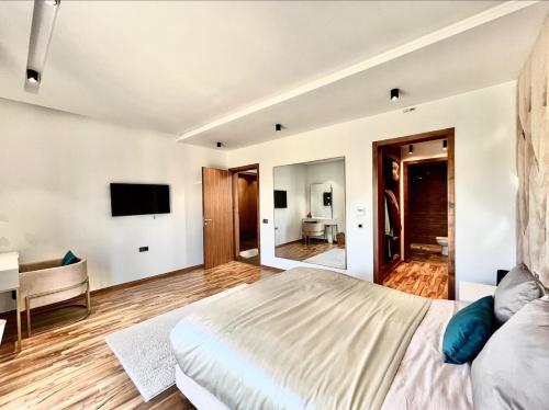 a bedroom with a large bed and a desk at Villa Elia Luxury Oasis in Marrakech