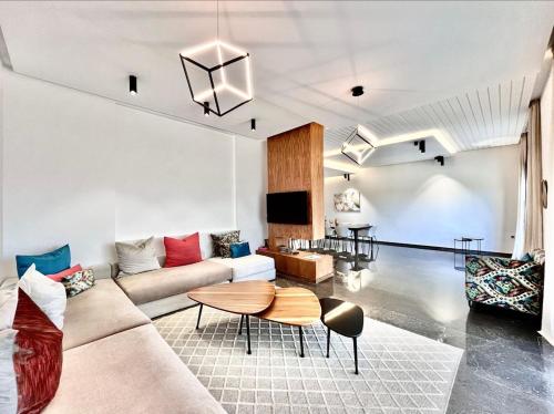 a living room with a couch and a table at Villa Elia Luxury Oasis in Marrakech