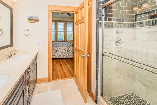 a bathroom with a shower and a sink at Run-A-Way Bay in Duck