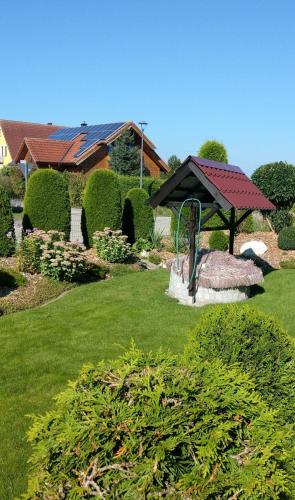 a garden with a playground and a gazebo at ruhiger als im Hotel, keine andere Gäste in Merkendorf