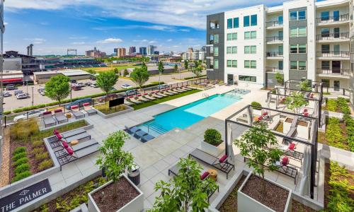 an overhead view of the pool at the mage apartments at Upscale 2BR Near Regions Field n Park in Birmingham