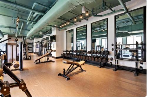 a gym with a bunch of equipment in a room at Cozy Murphy Hideaway Studio 13th in Birmingham