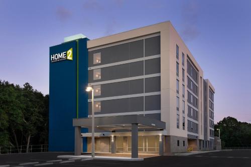 a rendering of a building with a hotel sign at Home2 Suites By Hilton Weston Ft. Lauderdale in Davie