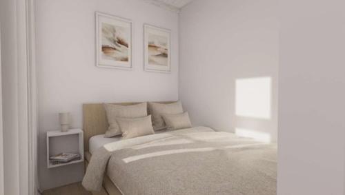 a white bedroom with a bed and a window at Superb Old Town Apartment in Klaipėda