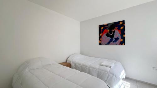 Postel nebo postele na pokoji v ubytování Temporario Sur, hasta 3 personas con 2 camas, cochera