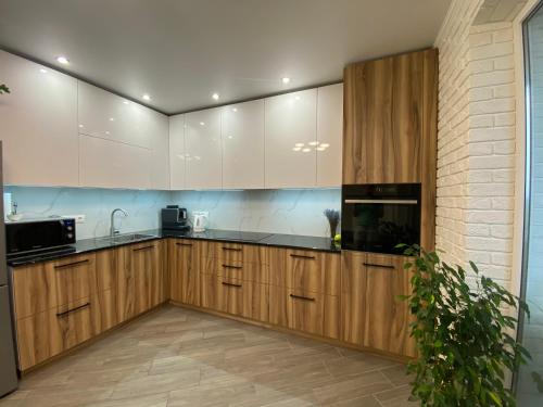 Η κουζίνα ή μικρή κουζίνα στο Cappuccino Apartment in new building