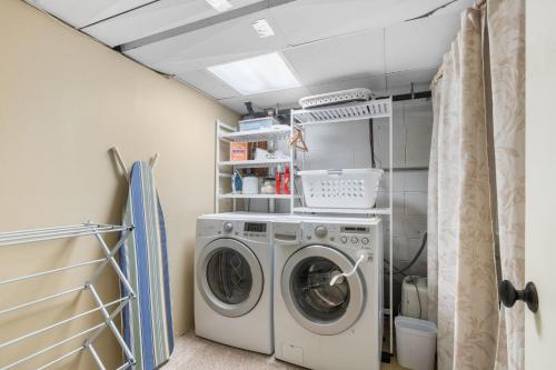 a laundry room with a washer and dryer at Woodland Hollow in Minnetonka