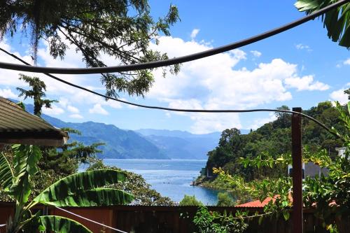 a view of a lake from a house at Aliix Sapo Rooms in San Juan La Laguna