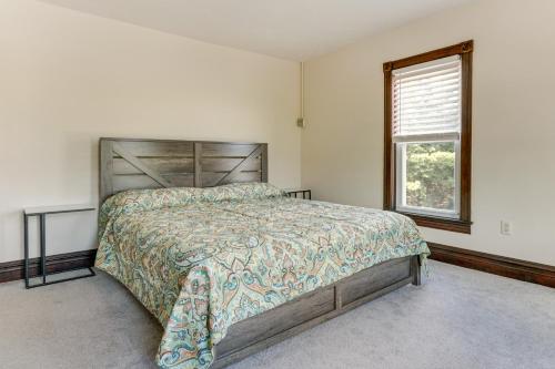 a bedroom with a large bed and a window at Golf Course Guest Suite in Gettysburg in Gettysburg