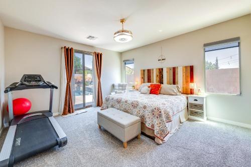 a bedroom with a bed and a television in it at San Tan Valley Vacation Rental with Community Perks! in San Tan Valley