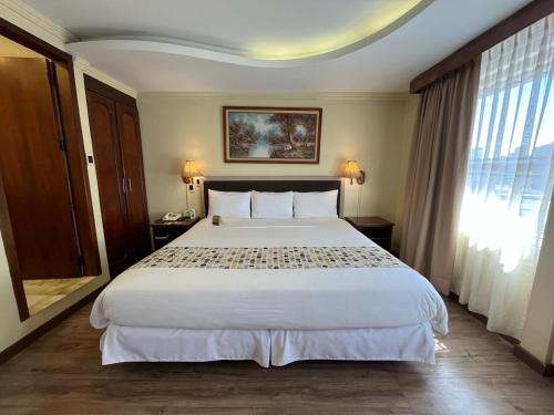 Ένα ή περισσότερα κρεβάτια σε δωμάτιο στο Hotel Republica