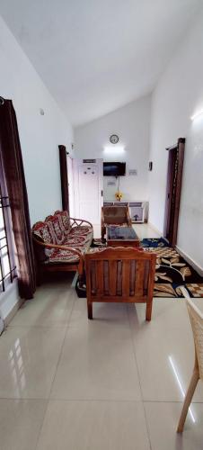 a living room with a couch and a coffee table at Valley View in Kodaikānāl