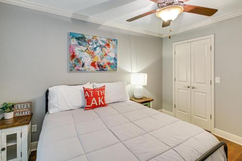 a bedroom with a bed with a red pillow on it at Tranquil Views Riverfront Retreat in Hot Springs! in Hawes