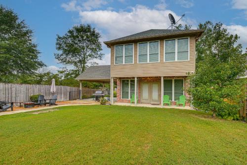 a house with a yard with a lawn sidx sidx sidx at Tranquil Views Riverfront Retreat in Hot Springs! in Hawes