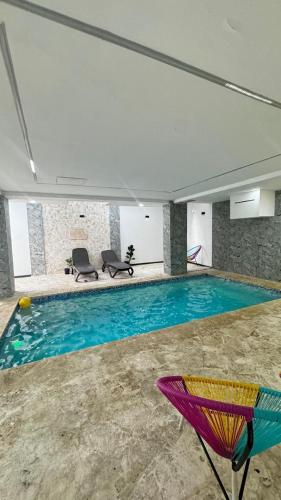 a large swimming pool in a large building with at Apartmet luxury monaco in Juan López