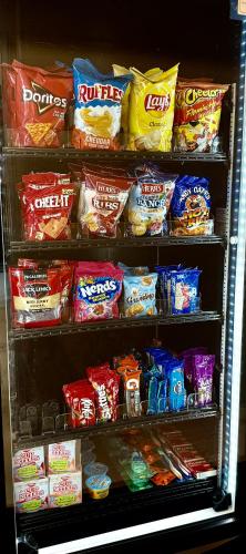 a refrigerator filled with lots of different types of food at Days Inn by Wyndham Arlington in Arlington