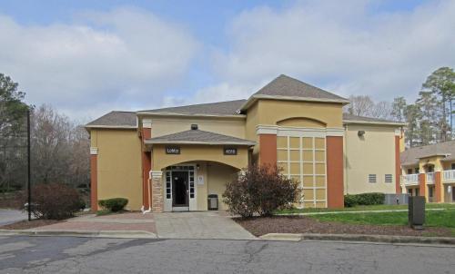 a large building with at Suburban Studios Raleigh - Crabtree Valley in Raleigh