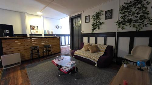 a living room with a couch and a table at Oceana Suites Chile Hostel in Santiago