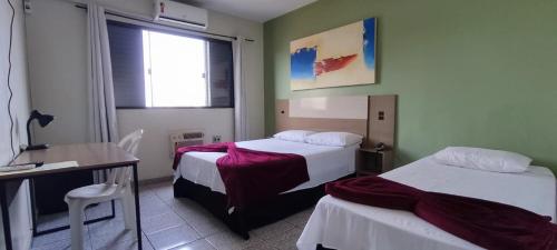 Ένα ή περισσότερα κρεβάτια σε δωμάτιο στο Hotel Gran Fenícia Marechal