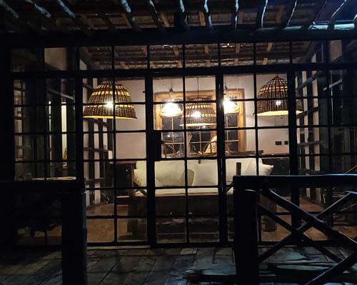 a room with two birds in cages at DesertDewEstate in Nanyuki