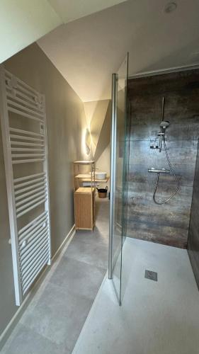 a bathroom with a shower and a sink in a room at Ty Glaz - Maison Bord de mer avec jardin, proche plage in Roscoff