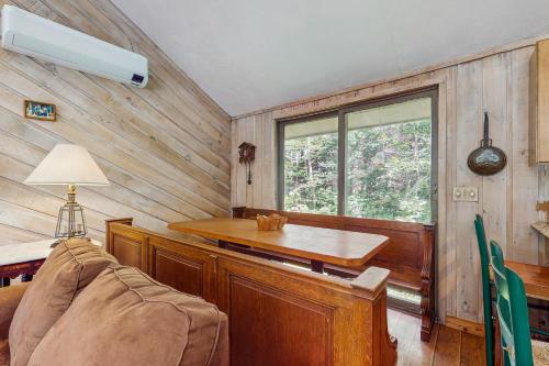 a room with a desk and a table and a window at Ahmeek Retreat in Podunk