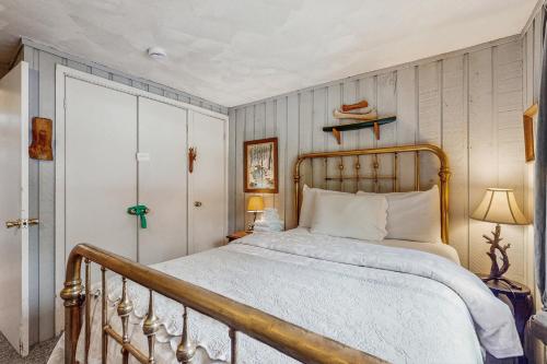 a bedroom with a large bed with a wooden frame at Ahmeek Retreat in Podunk
