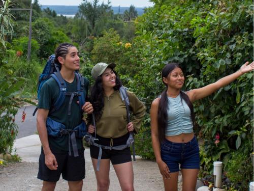a group of three people standing on a trail at Ama Ecolodge in Puerto Misahuallí