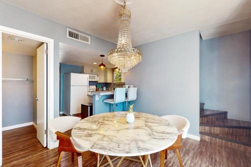 a kitchen and dining room with a table and chairs at Glendale Groovin' in Glendale