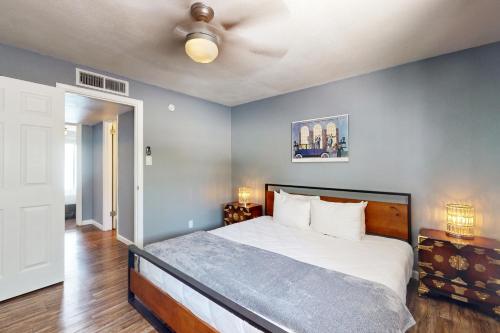 a bedroom with a bed and a ceiling fan at Glendale Groovin' in Glendale