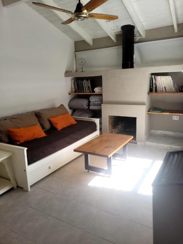 a living room with a couch and a table at LAS ORQUIDEAS in Plottier