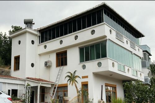a white building with a lot of windows at Villarome in Çakırlar