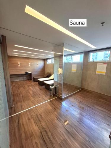 a room with a bed and a glass wall at FLAT 313 S4 Hotel in Brasília