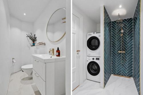 a bathroom with a washing machine and a washer at Central Odense Hideaway – Courtyard Apartment in Odense