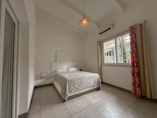 Ένα ή περισσότερα κρεβάτια σε δωμάτιο στο Villa Casa Azul & Arena Blanca Apartamentos