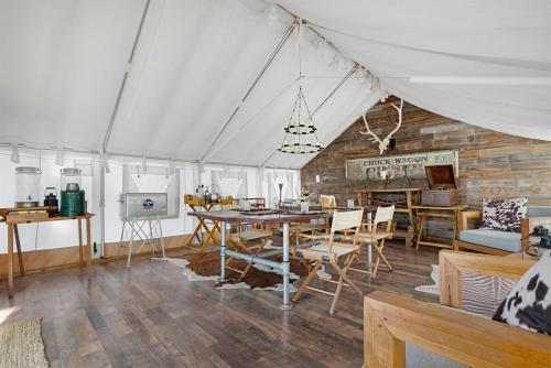 a tent with a table and chairs in a room at Private Dome Getaway - 30min to Grand Canyon in Valle