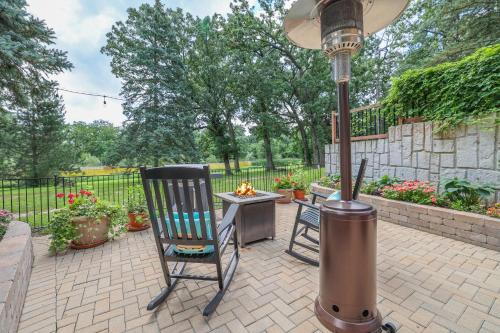 a patio with two chairs and a street light at Harmony Inn, Huntley Illinois in Huntley