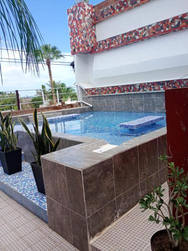Bazén v ubytování Hotel Mágico del Mar nebo v jeho okolí
