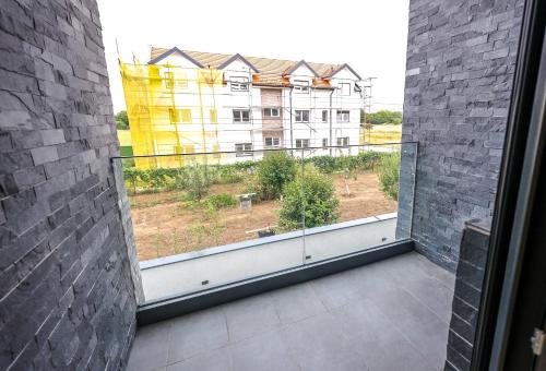 an open window with a view of a building at Villa Cocosinella Belgrade in Surčin