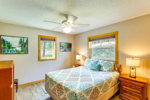 a bedroom with a bed and a ceiling fan at Hayward Valley House Black Hills Family Retreat in Keystone