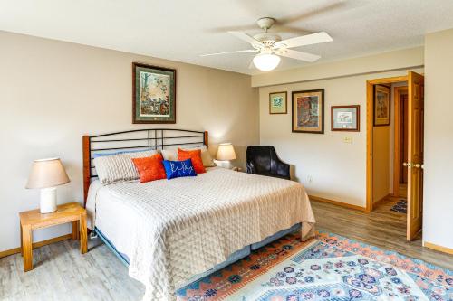 a bedroom with a bed and a ceiling fan at Hayward Valley House Black Hills Family Retreat in Keystone