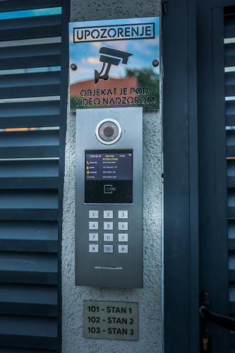 a parking meter with a sign on top of it at Villa Cocosinella Belgrade in Surčin