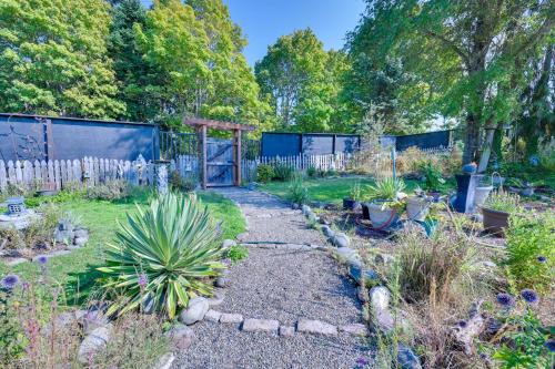 a garden with many plants and a fence at Shared Yard Apt 2 Mi to Port Angeles City Pier in Port Angeles