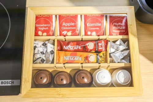 a wooden box filled with different types of food at Villa Cocosinella Belgrade in Surčin