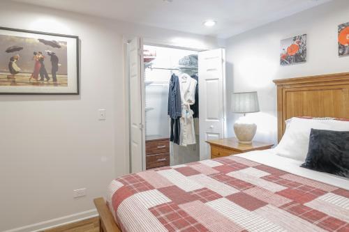 a bedroom with a bed and a walk in closet at Harmony Inn, Huntley Illinois in Huntley